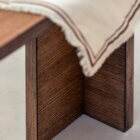 Detail photograph of the Chermayeff dining table in dark stained finish.