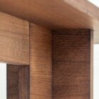 Detail photograph of the Chermayeff dining table in dark stained finish.