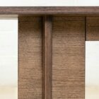 Detail photograph of the Chermayeff dining table in dark stained finish.