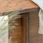 Detail photo of the Corbusier coffee table in dark stained finish.