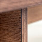 Detail photo of the Corbusier coffee table in dark stained finish.