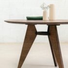 Photograph of the Prouvé dining table in dark stained finish.