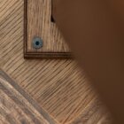 Detail photo of the Schlemmer coffee table in dark stained finish.