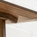 Detail photo of the Schlemmer coffee table in dark stained finish.